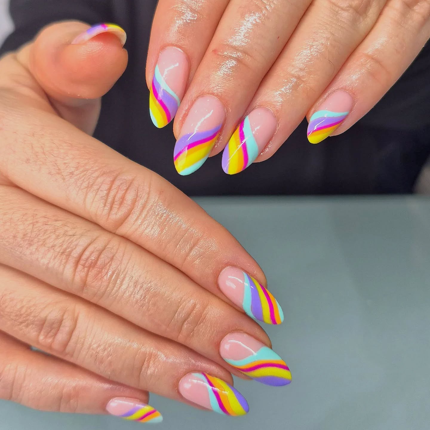 Pastel rainbow swirl nail art created at Studio J, Swords